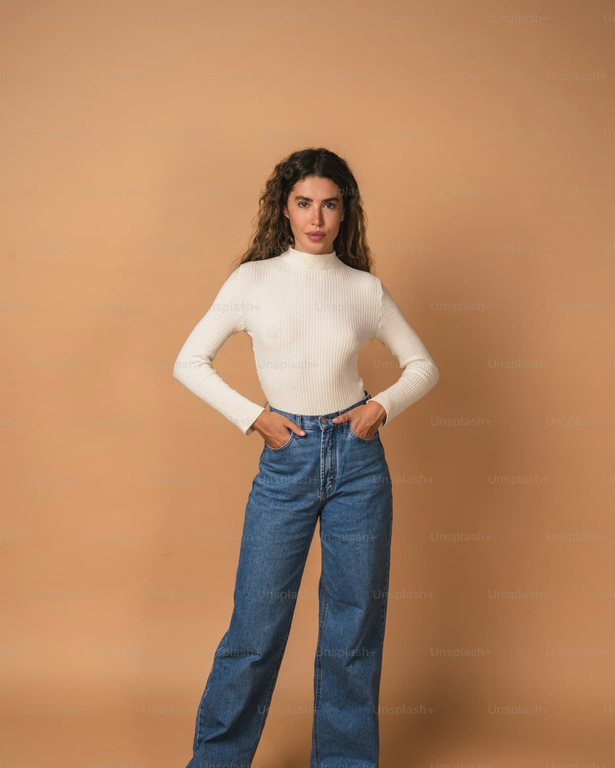 Raw indigo high-waist straight-leg jeans, front view